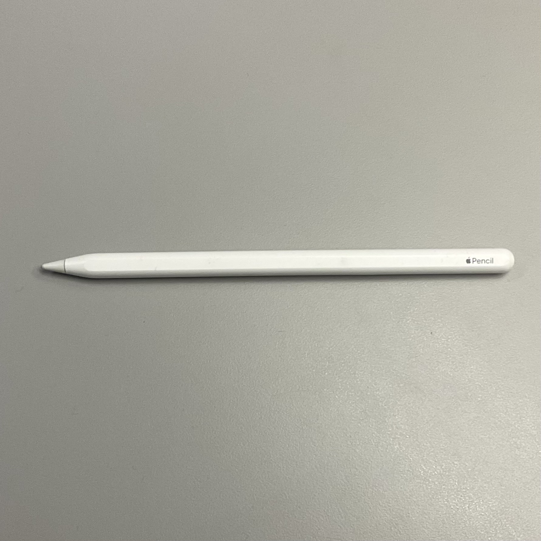 a white apple pencil lay down